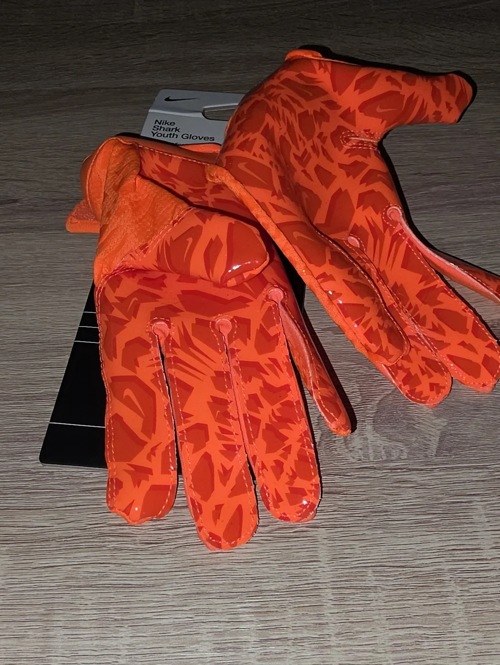 Nike Youth Bright Orange Football Gloves with Black Swoosh